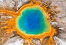 Sulfur and the origin of life Grand Prismatic Spring in Yellowstone National Park, seen here from an aerial photo, provides a modern-day glimpse into the types of environments where sulfites may have accumulated and possibly played a role in kick-starting the earliest life on Earth.