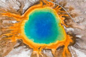 Grand Prismatic Spring in Yellowstone National Park, seen here from an aerial photo, provides a modern-day glimpse into the types of environments where sulfites may have accumulated and possibly played a role in kick-starting the earliest life on Earth.