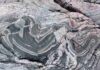 Rock steady: Study reveals new mechanism to explain how continents stabilized These ancient metamorphic rocks called gneisses, found on the Arctic Coast, represent the roots of the continents now exposed at the surface. The scientists said sedimentary rocks interlayered in these types of rocks would provide a heat engine for stabilizing the continents. Credit: Jesse Reimink. All Rights Reserved.