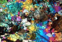 New study supports stable mantle chemistry dating back to Earth’s early geologic history and over its prodigious evolution A thin slice of the ancient rocks collected from Gakkel Ridge near the North Pole, photographed under a microscope and seen under cross-polarized light. Field width ~ 14mm. Credit: E. Cottrell, Smithsonian.