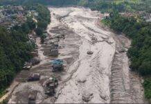 Nepal Flash Flood, August 2026: Ice-Rock Avalanche, River Damming, and Cascading Himalayan Hazards A drone view shows mud covering properties following a flash flood at Trishuli in Nuwakot district, Nepal, on Wednesday. Stringer/Reuters